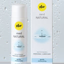Pjur med Natural water-based personal lubricant bottle and packaging on a light gray background