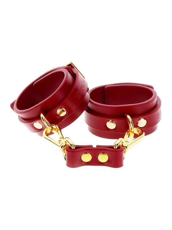 RED FAUX LEATHER WRIST CUFFS